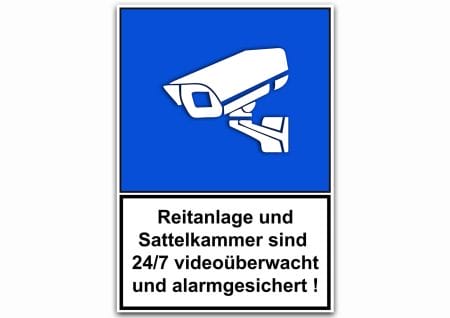 Ein Schild mit blauem Hintergrund und einem Stallschild „Videoüberwacht“ (Kopie) darauf.